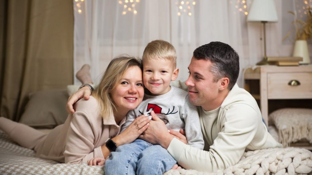 a family sitting on a couch